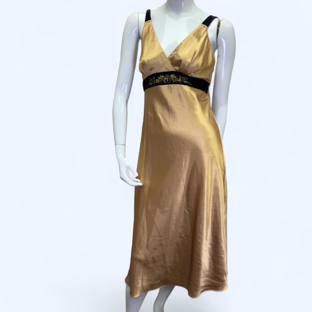 gold satin slip dress with black velvet empire waist and ornate gold embroidery